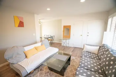 a living room with a couch and a table at Bright and Comfortable 2 Bedrooms with Views in Santa Monica in Los Angeles