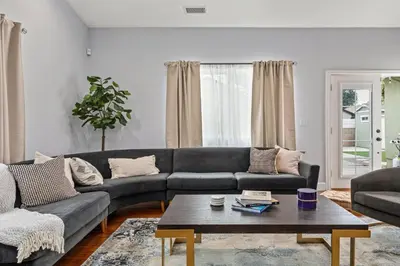 a living room with a couch and a coffee table at Luxury home w/ yard + parking in Newhall