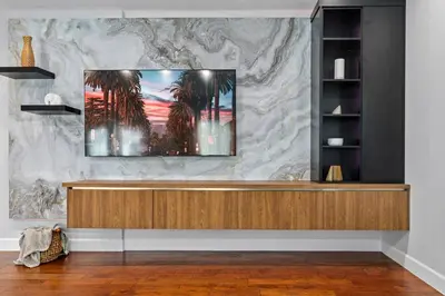 a lobby with a tv on a marble wall at Luxury home w/ yard + parking in Newhall