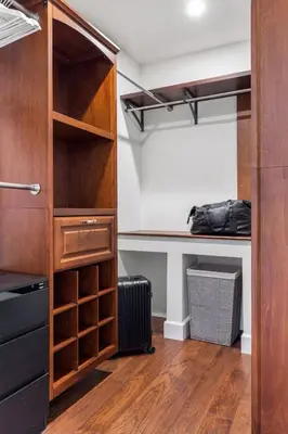 a closet with wooden shelves and a desk in a room at Luxury home w/ yard + parking in Newhall