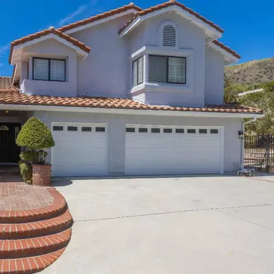 a house with a driveway and a garage at Goode.Homes Hilltop Home w. private pool/spa in Newhall