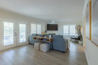 a living room with a couch and a tv at Goode.Homes Hilltop Home w. private pool/spa in Newhall