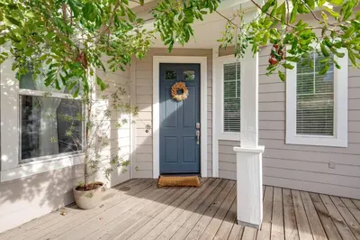 a front door of a house with a blue door at GOODE.HOMES | Luxury Home w/ pool & lush gardens in Santa Clarita