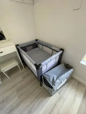 a small room with a bed and a desk at Large 6-bedroom house w/jacuzzi in Monterey Park