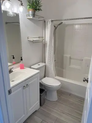 a bathroom with a toilet and a sink and a shower at Large 6-bedroom house w/jacuzzi in Monterey Park