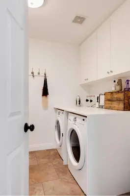 a white laundry room with a washer and dryer at Mountain View Home with Pool & Fenced-In Yard in Santa Clarita