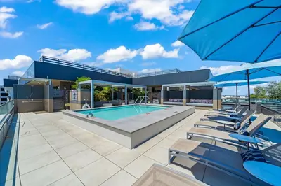 a swimming pool on the roof of a house at Stylish City Escape Walk to Shops Dine & Explore in Long Beach