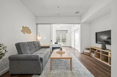 a living room with a couch and a coffee table at Stylish City Escape Walk to Shops Dine & Explore in Long Beach