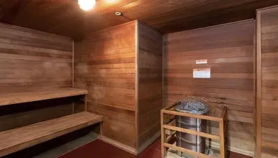 a sauna with wooden walls and wooden shelves at Aqua Towers in Long Beach