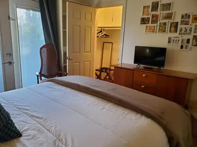 a bedroom with a bed and a tv on a dresser at Hidden Gem In Plain Sight in Van Nuys Airport