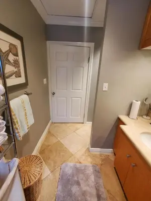 a bathroom with a sink and a white door at Hidden Gem In Plain Sight in Van Nuys Airport