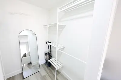 a dressing room with a mirror and a dressing table at Family Friendly Southwest Bakersfield Retreat with Jacuzzi and Fenced Yard in Bakersfield