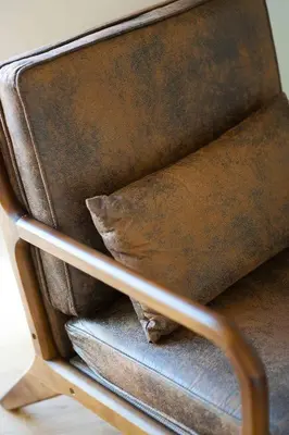 a brown leather chair with a pillow on it at University Hill Home With City Views, Hot Tub and 3 Parking Spots in Los Angeles
