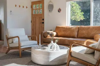 a living room with a couch and chairs and a table at University Hill Home With City Views, Hot Tub and 3 Parking Spots in Los Angeles