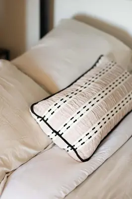 a pillow sitting on top of a bed at University Hill Home With City Views, Hot Tub and 3 Parking Spots in Los Angeles