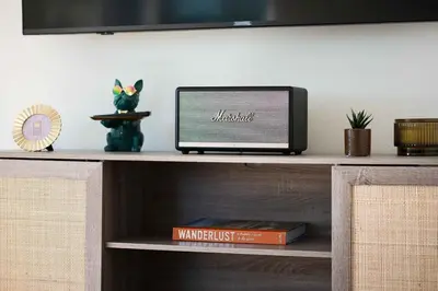 a laptop computer sitting on top of a shelf at University Hill Home With City Views, Hot Tub and 3 Parking Spots in Los Angeles