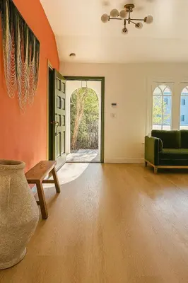 an empty living room with a couch and a table at WeHo Pool Retreat - Holiday Ready in Los Angeles