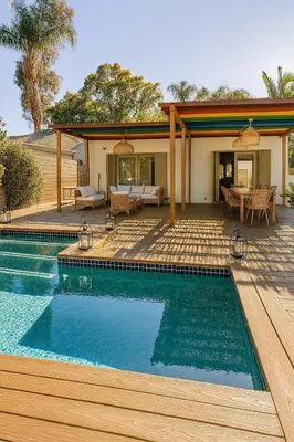 a swimming pool in front of a house at WeHo Pool Retreat - Holiday Ready in Los Angeles