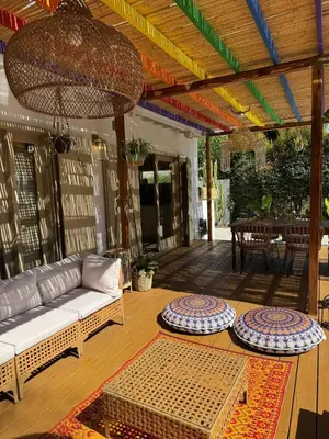a living room with a couch and a table at WeHo Pool Retreat - Holiday Ready in Los Angeles