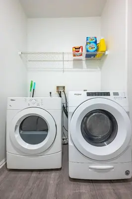 a washing machine and a washer in a room at Cozy 3 BR Apartment | Near Disney in Placentia