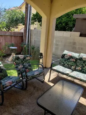 a patio with two chairs and a couch and a table at Spacious home near LAX in Hawthorne