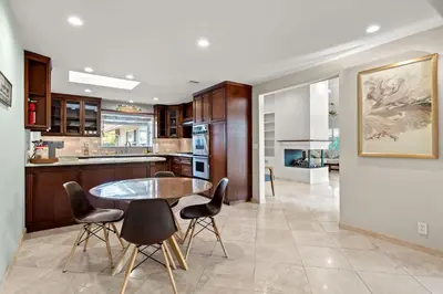a kitchen with a table and chairs in a room at Airy Large Backyard Oasis Perfect Family Getaway in Tustin