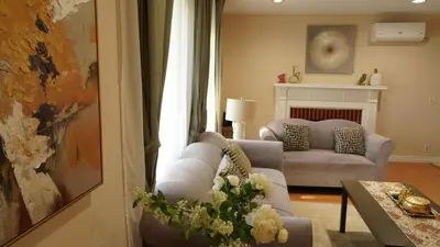 a living room with a couch and a chair at Entire house with 3 rooms in Alhambra