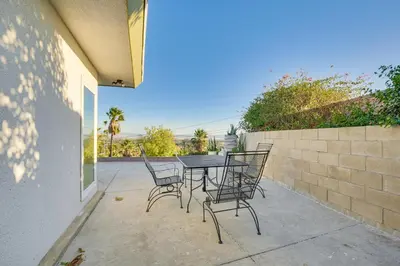 a table and chairs sitting on a patio at Stunning MCM Escape with Mtn Views in San Bernardino in San Bernardino