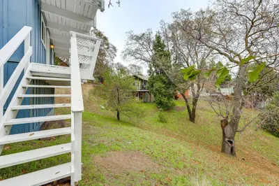 a white staircase leading up to a house at 2 Mi to Lake Arrowhead! Mtn-View Hideaway with Deck in Cedar Glen