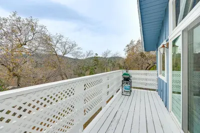 a generator sits on the porch of a house at 2 Mi to Lake Arrowhead! Mtn-View Hideaway with Deck in Cedar Glen