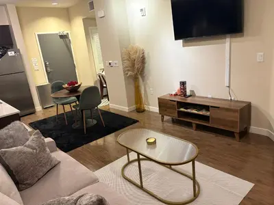 a living room with a couch and a table at Luxurious precious mile in Los Angeles
