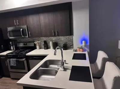 a kitchen with a sink and a stove at DTLA prime one bedroom steps away from Crypto in Los Angeles