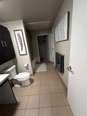 a bathroom with a toilet and a sink at DTLA prime one bedroom steps away from Crypto in Los Angeles