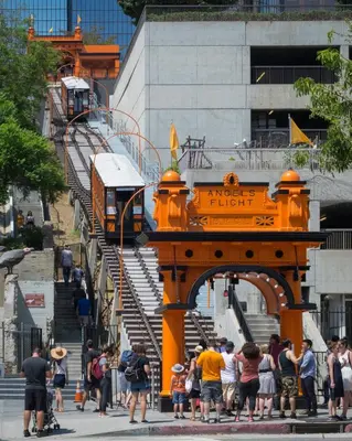 a group of people waiting to get on a train at DTLA prime one bedroom steps away from Crypto in Los Angeles