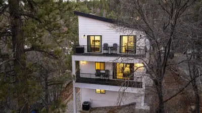 an aerial view of a white house with a balcony at Skyline Summit Lodge in Big Bear Lake