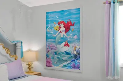 a painting of a mermaid on a wall in a bedroom at Disney Frozen Fantasy by OC Adventure Homes in Garden Grove