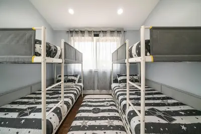 a group of bunk beds in a room at Star Wars Retreat by OC Adventure Homes in Garden Grove