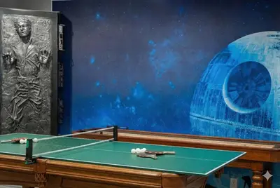 a pool table with two cue balls on top of it at Star Wars Retreat by OC Adventure Homes in Garden Grove