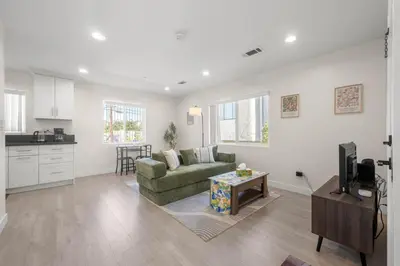 a living room with a couch and a table at Niagara Haven Unit 103 in Burbank