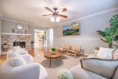 a living room with white furniture and a fireplace at Marbella Lane - Charming 4BR Bungalo for Relaxing Retreat in Fullerton