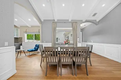 a dining room with a table and chairs at Modern Luxe Villa Pool Rooftop Paradise in Sherman Oaks