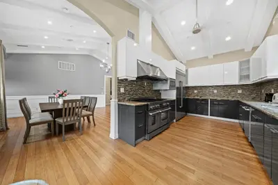 a kitchen with a table and a dining room at Modern Luxe Villa Pool Rooftop Paradise in Sherman Oaks