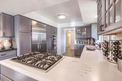 a kitchen with a stove top oven in a kitchen at Marbella Lane - Serene Ranch Style Home wPool in Fullerton