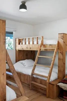 two wooden bunk beds in a room with a window at Ojai Valley - Pool and Pickle Ball in Ojai