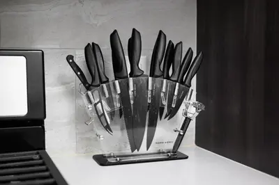 a bunch of knives in a container on a counter at Casa Clementine - 10 min to SNA&Beach Plus Free Parking in Orange