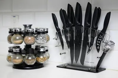 a kitchen counter with a bunch of knives and spices at The Belladonna at Main Place - Disney Gift Card! in Orange