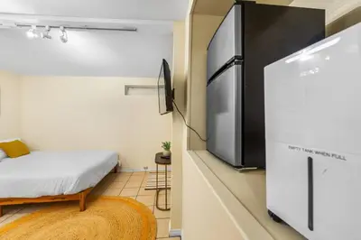 a small room with a refrigerator and a bed at Netflix, Stocked Kitchenette, Beach Gear in Ventura