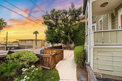 a house with a fence on the side of it at Netflix, Stocked Kitchenette, Beach Gear in Ventura
