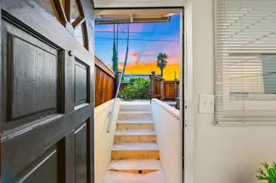 a stairway leading into a house with a sunset at Netflix, Stocked Kitchenette, Beach Gear in Ventura