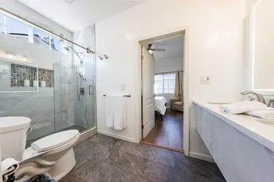 a bathroom with a shower and a toilet and a sink at Welcoming & Spacious 2-Bedroom Guest Suite in Torrance 20 Minutes from LAX in Torrance